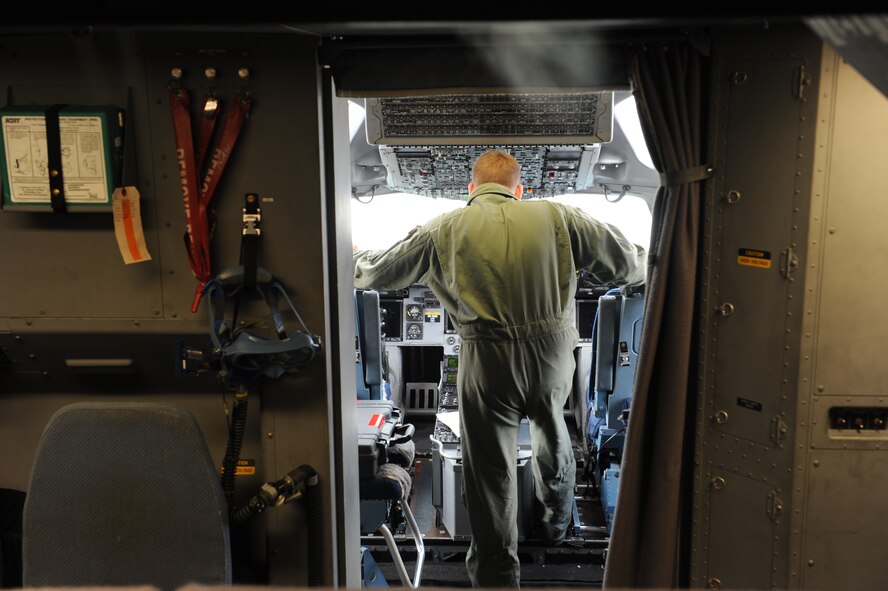Staff Sgt. Jason Chaltry, 15th Aircraft Maintenance Squadron flying crew chief, performs pre-flight maintenance on a C-17 Globemaster III from the 535th Airlift Squadron at Joint Base Pearl Harbor Hickam, Hawaii, April 6 at Andersen Air Force Base, Guam, while on a five-day mission to fly, execute airdrops, and foster joint service and international operability in the Pacific theater. During the mission, the aircrew dropped static-line personnel, heavy equipment platforms, high-velocity container delivery system bundles, low-velocity CDS bundles, and High-Altitude Low-Opening jumpers during their time in Guam. (U.S. Air Force photo by Staff Sgt. Nathan Allen)