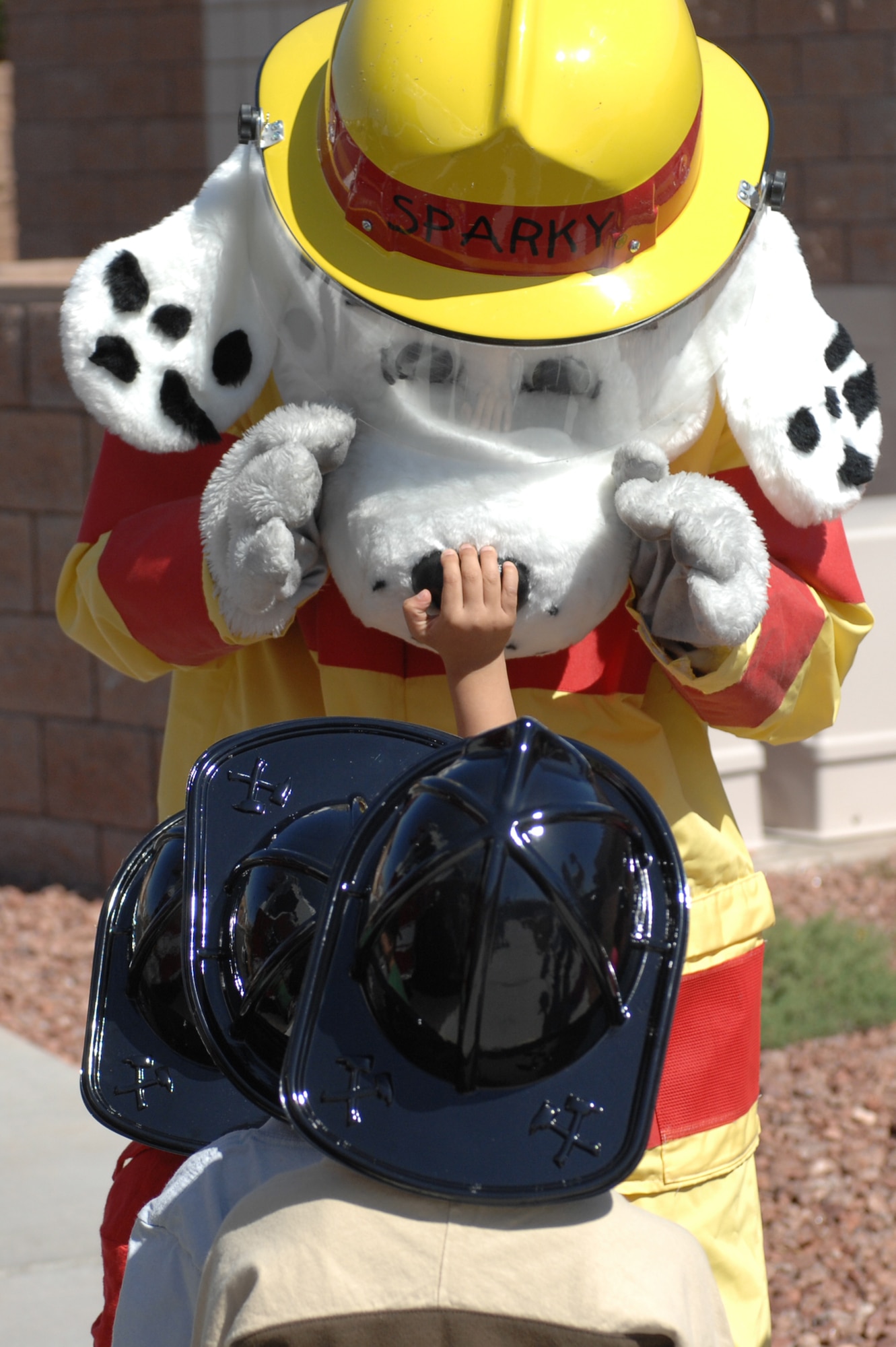 Sparky the Fire Dog entertains children at the Child Development Center during a visit from the 99th Civil Engineer Squadron fire department, April 10, 2012, at Nellis Air Force Base, Nev. Sparky the Fire Dog has been the official mascot of the National Fire Protection Association since 1951. (U.S. Air Force photo by Senior Airman Jack Sanders)
  

