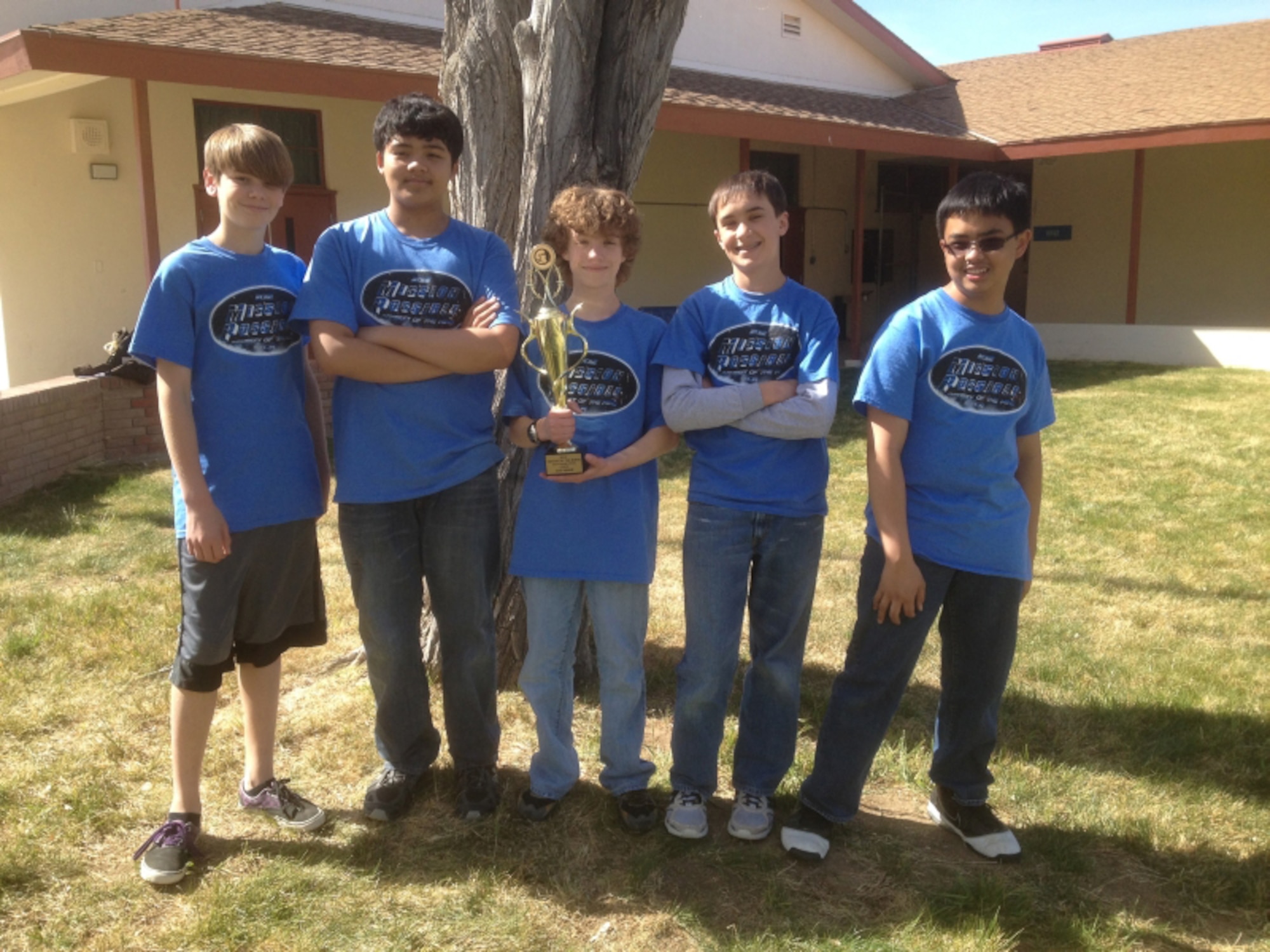A team of five students from Desert Junior High School shows off their trophy that they earned in the state competition for Odyssey of the Mind, March 31. The students received the invitation to attend the World Finals after winning at regional and state competitions. The team will travel to Iowa State University in May to compete with students from all over the world. (Courtesy Photo)