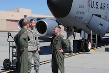 From left to right, Maj. Chad Bowden, 319th Operations Support Squadron director of operations, and Lt. Col. Joe Moritz, 319th Mission Support Group deputy commander speak with Maj. Jerry Bennett, 349th Air Refueling Squadron pilot April 14, 2012, Grand Forks Air Force Base, N.D. Bennett flew the first of 16 KC-135 Stratotankers that evacuated McConnell as a pro-active measure before projected storms hit the Midwest. (U.S. Air Force photo/ Airman 1st Class Jose L. Leon)