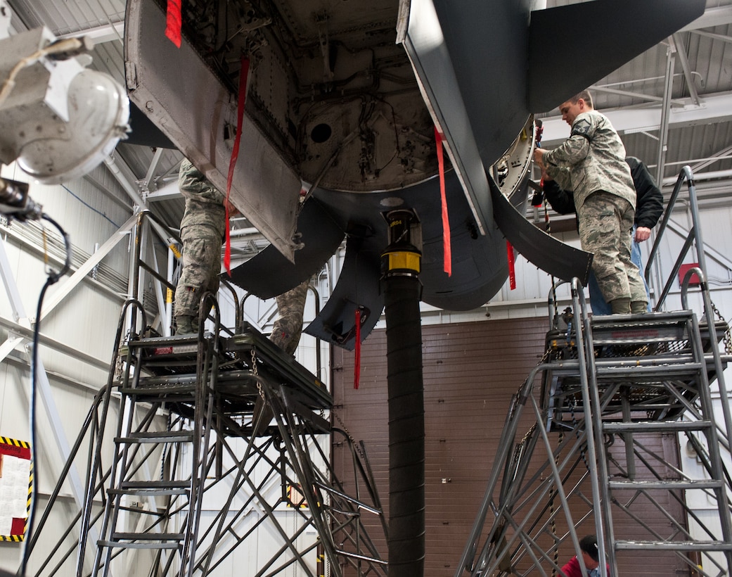 Members of the 28th Aircraft Maintenance Squadron install Radar Reliability and Maintainability Program systems into a B-1 bomber during upgrade maintenance at Ellsworth Air Force Base, S.D., April 11, 2012. The upgrade provided newer, lighter parts that increase the reliability of the radar system. (U.S. Air Force photo by Airman 1st Class Alystria Maurer/Released)