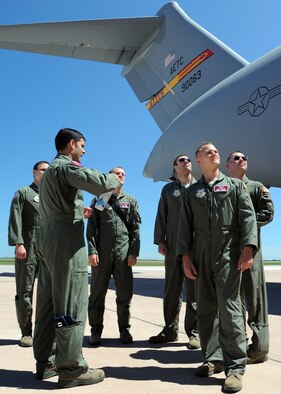 ALTUS AIR FORCE BASE, Okla. – Capt. Nathan F. Bailey, 58th Airlift Squadron C-17 Globemaster III formal training unit instructor pilot, educates cadets from the University of Oklahoma Air Force Reserve Officers Training Corps Detachment 675 about the C-17 Globemaster III on the flightline April 16, 2012. This is the second time cadets from OU AFROTC have visited Altus AFB to shadow mentors and learn more about their future jobs in the Air Force. (U.S. Air Force Photo by Airman Klynne Pearl J. Serrano / 97th Air Mobility Wing Public Affairs / Released)