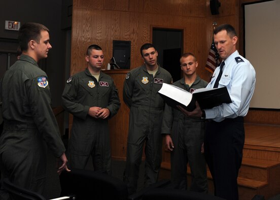 ALTUS AIR FORCE BASE, Okla. – Col. Jonathan Tamblyn, 54th Air Refueling Squadron commander, shows cadets from the University of Oklahoma Air Force Reserve Officers Training Corps Detachment 675 the KC-135 Stratotanker Legacy Roster in the Holsey Auditorium April 16, 2012. The Legacy Roster represents every pilot or operator who has ever worked in the KC-135 Stratotanker. (U.S. Air Force Photo by Airman Klynne Pearl J. Serrano / 97th Air Mobility Wing Public Affairs / Released)