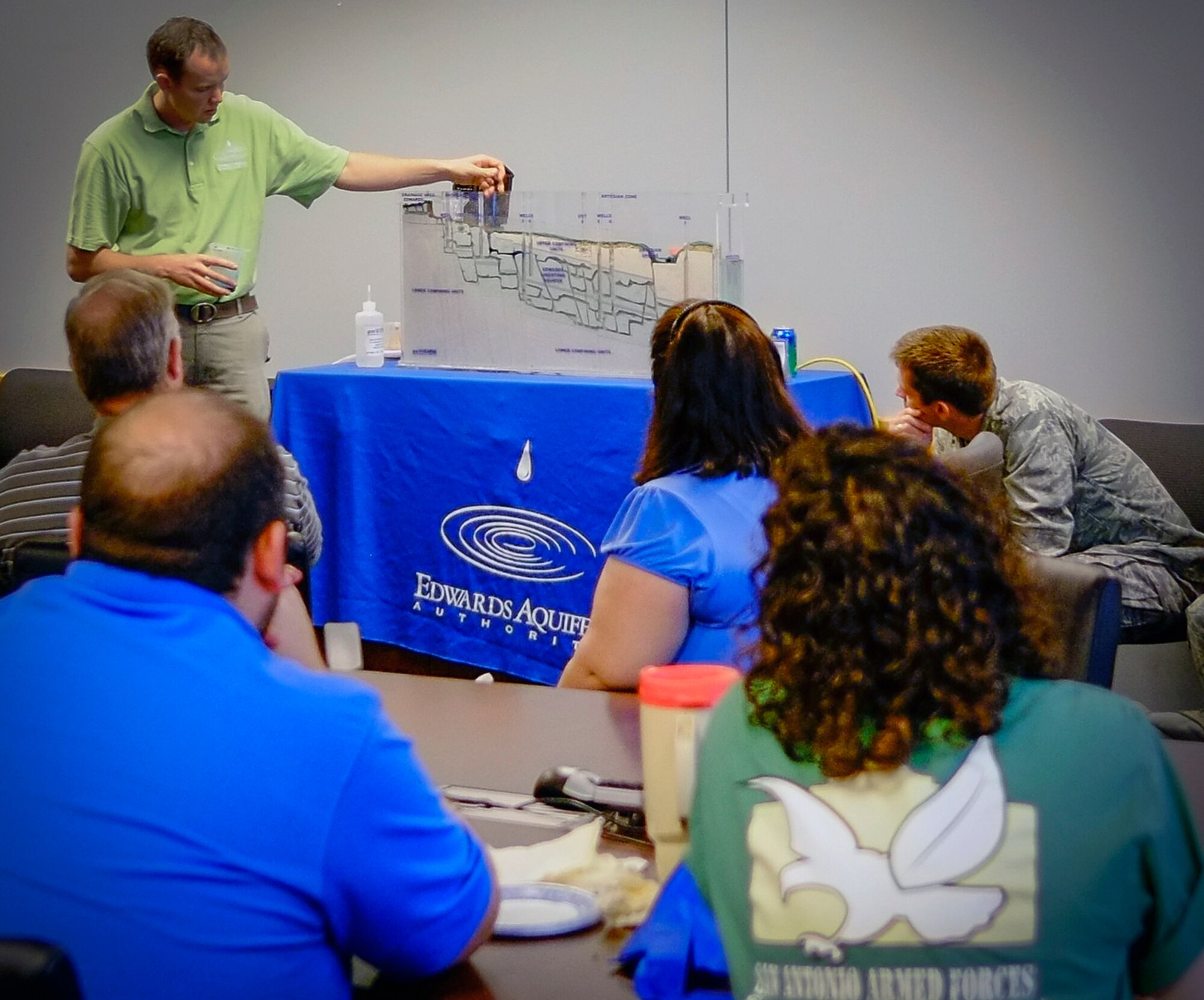 LACKLAND AIR FORCE BASE, Texas -- Edwards Aquifer Authority Senior Education Coordinator Brent Doty demonstrates how the aquifer works to an Air Force audience April 17  as part of Earth Day 2012 "Green Week" activities in Bldg. 171. The Edwards Aquifer, one of the most prolific artesian aquifiers in the world, is a unique groundwater system near San Antonio, America's seventh largest city. Doty's presentation focused on how the aquifer works, how the area's water source can be polluted and why restrictions are important to the successful management of the water system.  The presentation was among several events hosted by the Air Force Real Property Agency and the Air Force Center for Engineering and the Environment from April 12 - 22 in support of Earth Day and environmental awareness.  (U.S. Air Force photo/Jason Goode)