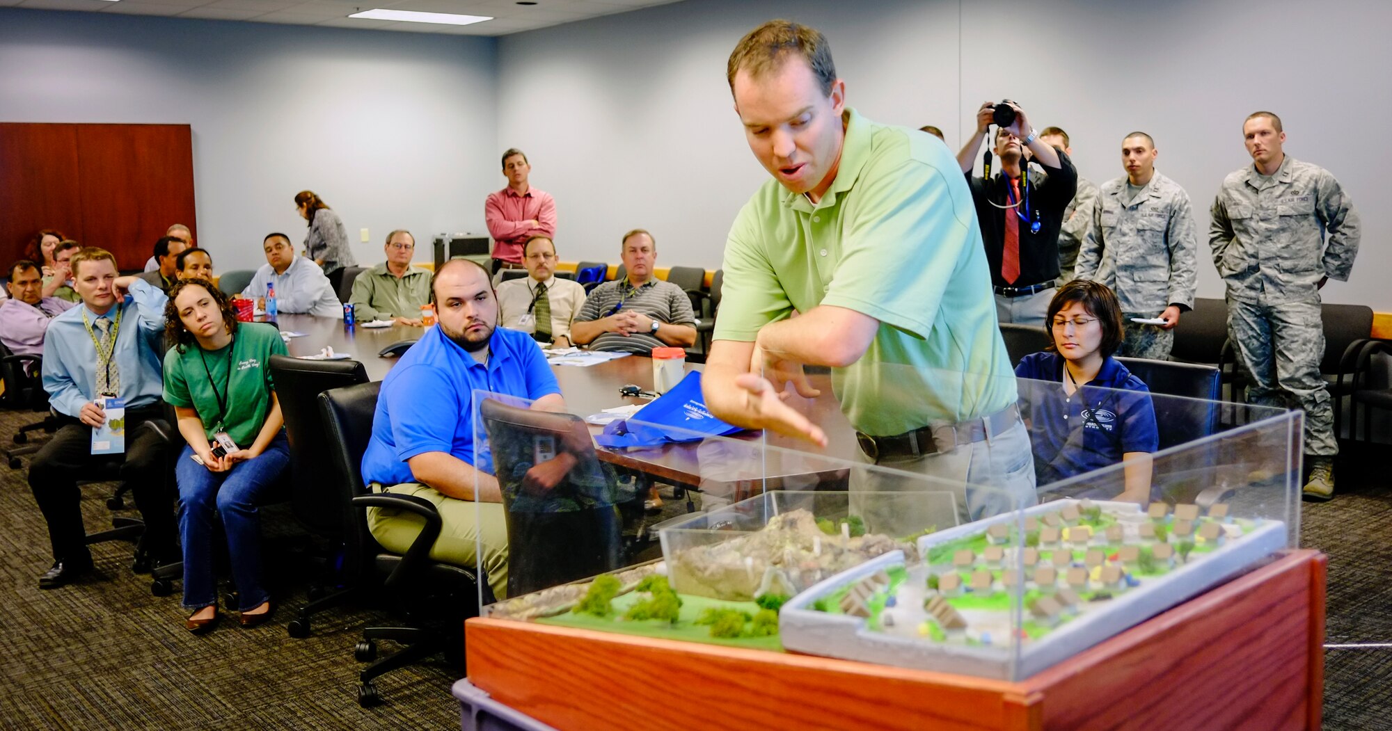 LACKLAND AIR FORCE BASE, Texas -- Edwards Aquifer Authority Senior Education Coordinator Brent Doty demonstrates how the aquifer works to an Air Force audience April 17  as part of Earth Day 2012 "Green Week" activities in Bldg. 171. The Edwards Aquifer, one of the most prolific artesian aquifiers in the world, is a unique groundwater system near San Antonio, America's seventh largest city. Doty's presentation focused on how the aquifer works, how the area's water source can be polluted and why restrictions are important to the successful management of the water system.  The presentation was among several events hosted by the Air Force Real Property Agency and the Air Force Center for Engineering and the Environment from April 12 - 22 in support of Earth Day and environmental awareness.  (U.S. Air Force photo/Steve Davis)