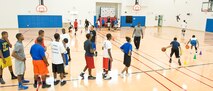 Members of the Dover Air Force Base, Del., Youth Center participate in a basketball skills development clinic at the Youth Center April 11, 2012, at Dover AFB. Alvin Jackson, director of 100% Tobacco-Free Sports, used the popularity of basketball to motivate youth to stay away from tobacco, drugs and alcohol. A.J. English, Former National Basketball Association player for the Washington Bullets, conducted the clinic. (U.S. Air Force photo by Roland Balik)