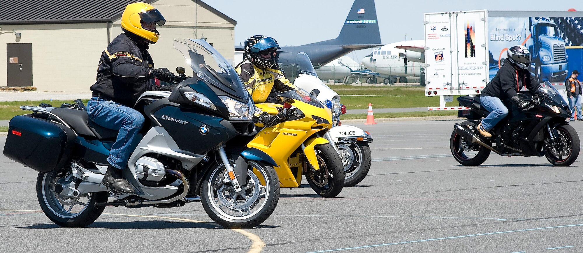 Team Dover members participate in a slow-drag competition during April 13, 2012, during Motorcycle Safety Day, at Dover Air Force Base, Del. Motorcycle Safety Day is a yearly event held to ensure riders and motorists are aware of increased safety measures while riding. (U.S. Air Force photo by Adrian R. Rowan)