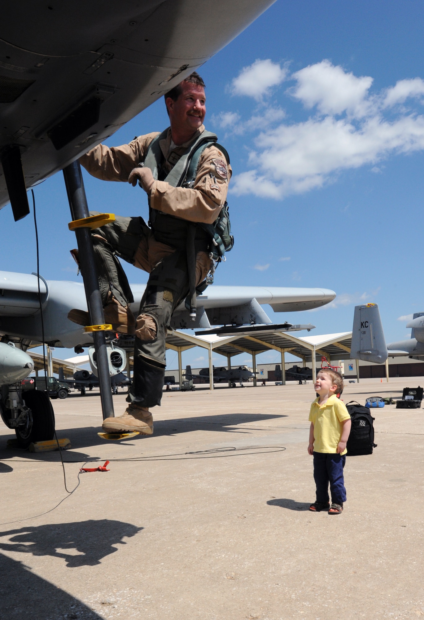 Maj. Brian Leiter, 303rd Fighter Squadron A-10 Thunderbolt II pilot, returns from Afghanistan April 17, 2012, while his son waits for his first hug. The 303rd FS is part of the 442nd Fighter Wing, an Air Force Reserve unit at Whiteman Air Force Base, Mo. (U.S. Air Force photo/Staff Sgt. Danielle Johnston)