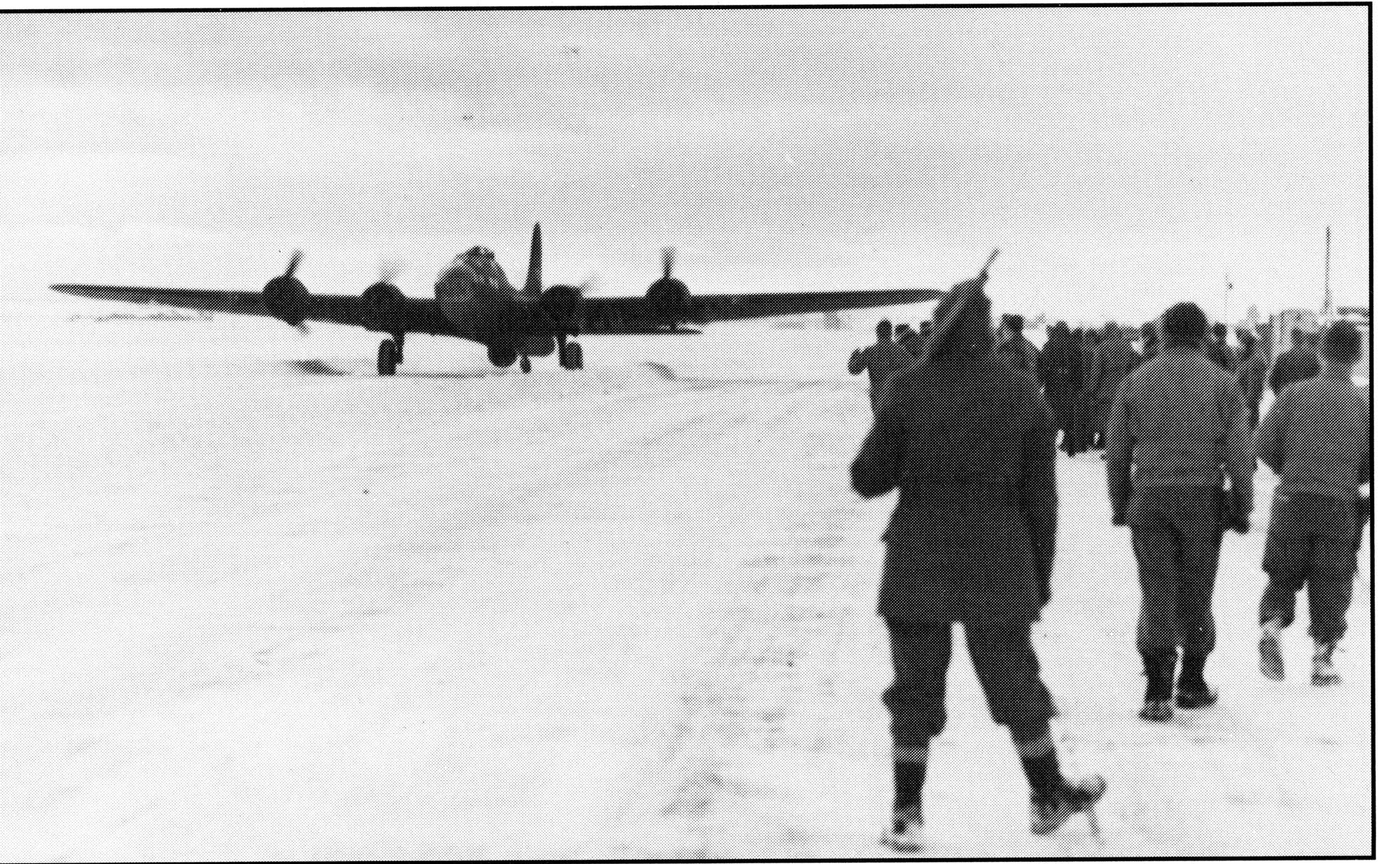 Spectators watch as Great Falls Army Air Base's first B-17 aircraft lands on the runway. (U.S. Air Force/courtesy photo)