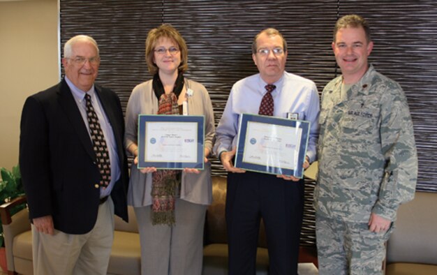 Ginger Henry, CEO of Prattville Baptist Hospital, second from right, and James R. Williams, director of pastoral care for Baptist Health System in Montgomery and Prattville, were recently recognized as “Patriotic Employers” by the ESGR. The award were presented by Alabama ESGR Committee member Norman Arnold, left, for support given to  908th Airlift Wing Chaplain David Dersch, far right.