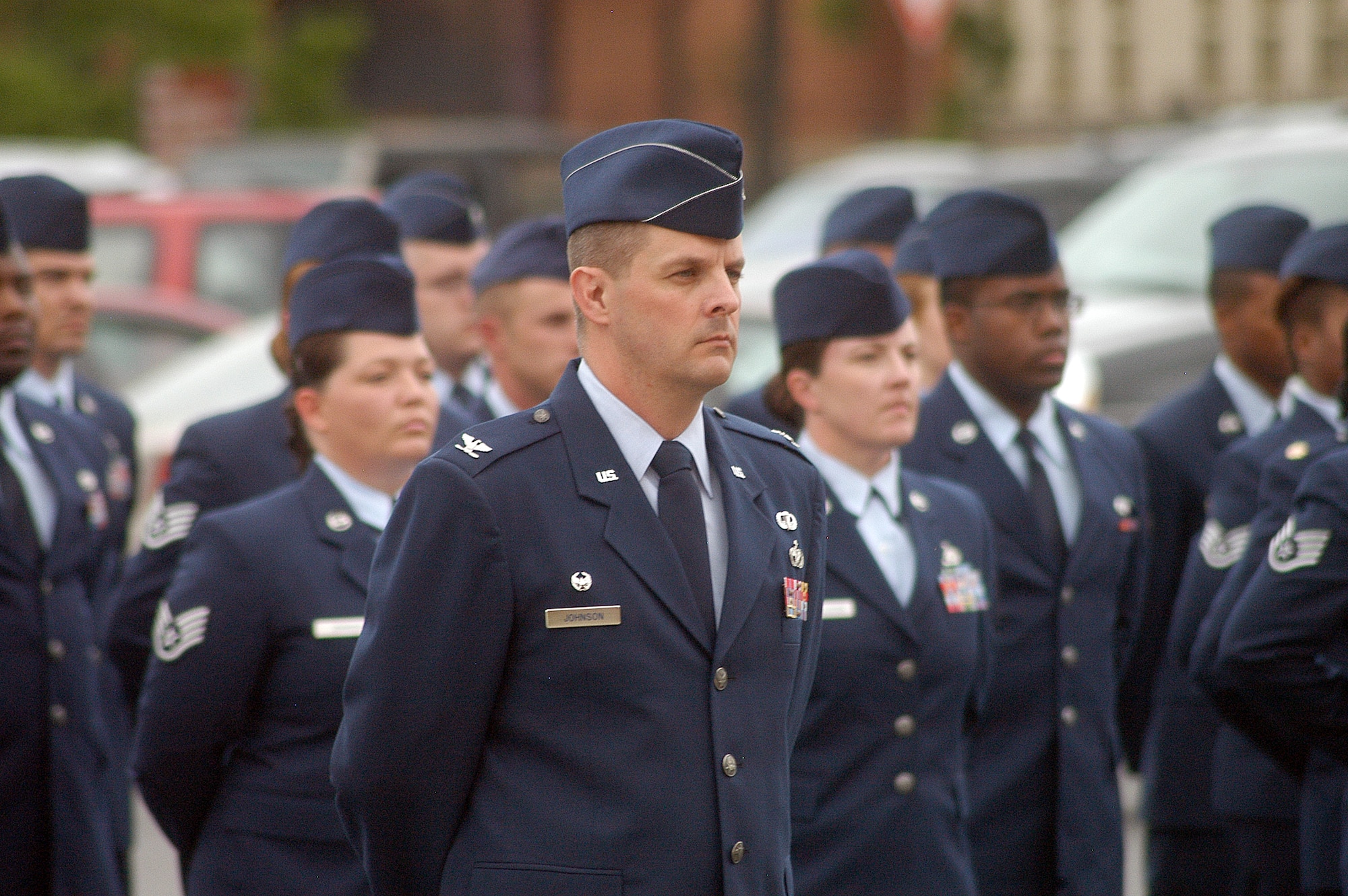 Col. Roger Johnson, 78th Mission Support Group commander, stands before a formation before a retreat ceremony in honor of the retirement of Chief Master Sgt. Eric R. Jaren, Headquarters  Air Force Materiel Command command chief. (U. S. Air Force photo by Sue Sapp)