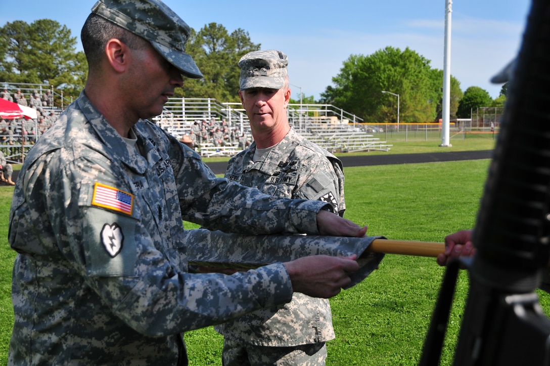 Col. Stephen Cherry, 7th Sustainment Brigade commander (provisional), cases the provisional colors during a Transfer of Authority ceremony at Fort Eustis’ Murphy Field April 13. Cherry, the departing commander, will assume new roles and responsibilities at the Combined Arms Sustainment Center of Excellence at Fort Lee, Va. (U.S. Army photo by Sgt. Edwin Rodriguez/Released)