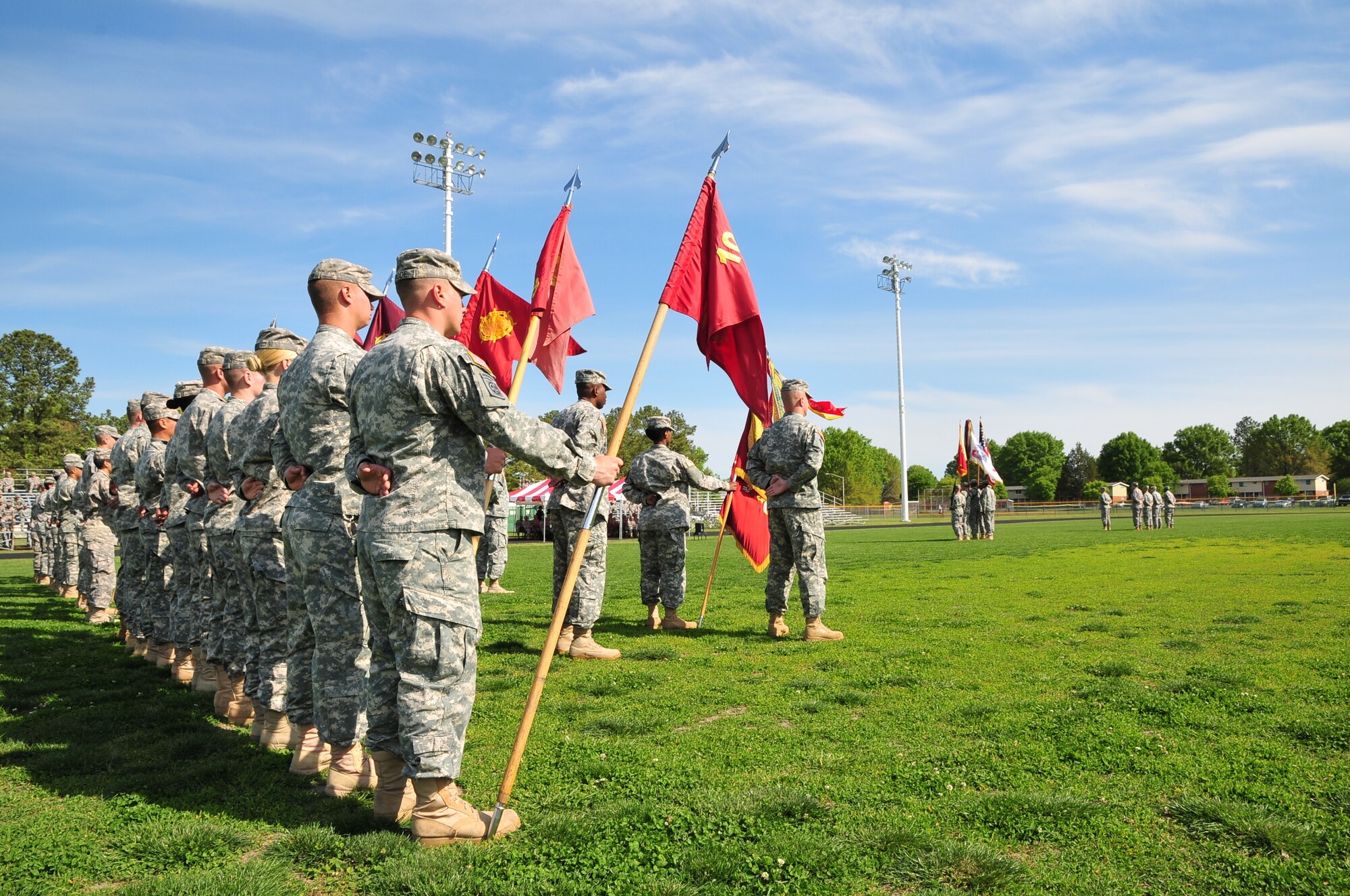 Various battalion and company colors assigned to the 7th Sustainment Brigade flow freely in the day during a Transfer of Authority ceremony held at Fort Eustis’ Murphy Field April 13. (U.S. Army photo by Sgt. Edwin Rodriguez/Released)