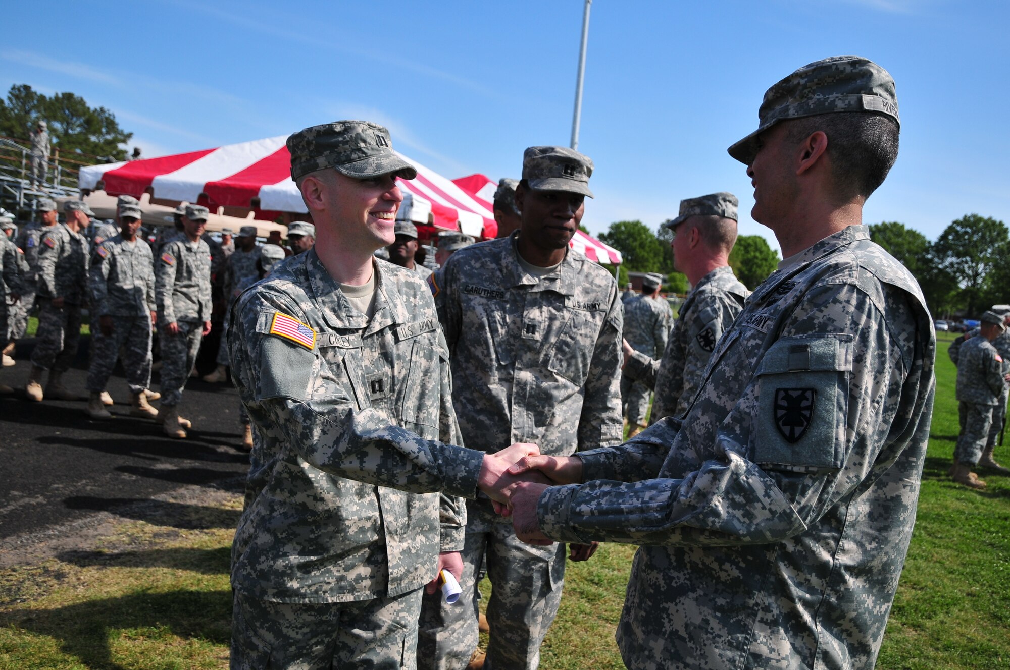 Lining up to bid farewell to the provisional 7th Sustainment Brigade commander, Col. Stephen Cherry, and Provisional Command Sgt. Maj., Command Sgt. Maj. Zacarias Rivera, right, as they relinquish command to Col. Lawrence Kominak and Command Sgt. Maj. Tony Escalona during a Transfer of Authority ceremony held at Fort Eustis’ Murphy Field April 13. (U.S. Army photo by Sgt. Edwin Rodriguez/Released)
