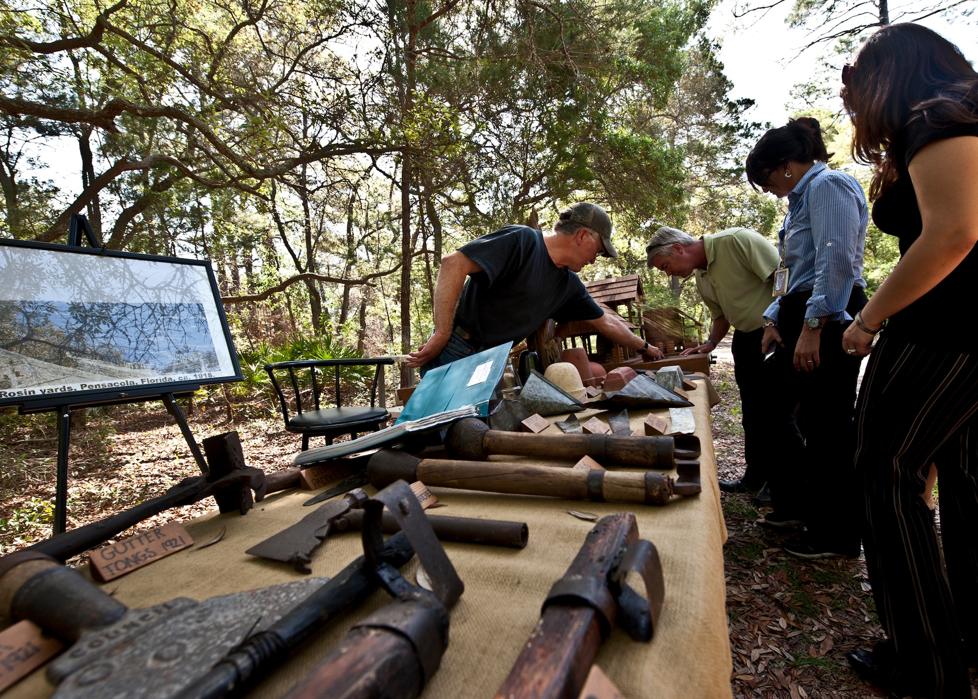 Jerry Melvin, a local historian, shows off his collection of turpentine artifacts found throughout Eglin and the surrounding area. The turpentine industry was the primary industry in northwest Florida from the late 1800 to the early 1900s. The display was part of a walking “eco-tour” on Eglin reservation near White Point in celebration of Eglin’s Earth Week.  (U.S. Air Force photo/Samuel King Jr.)