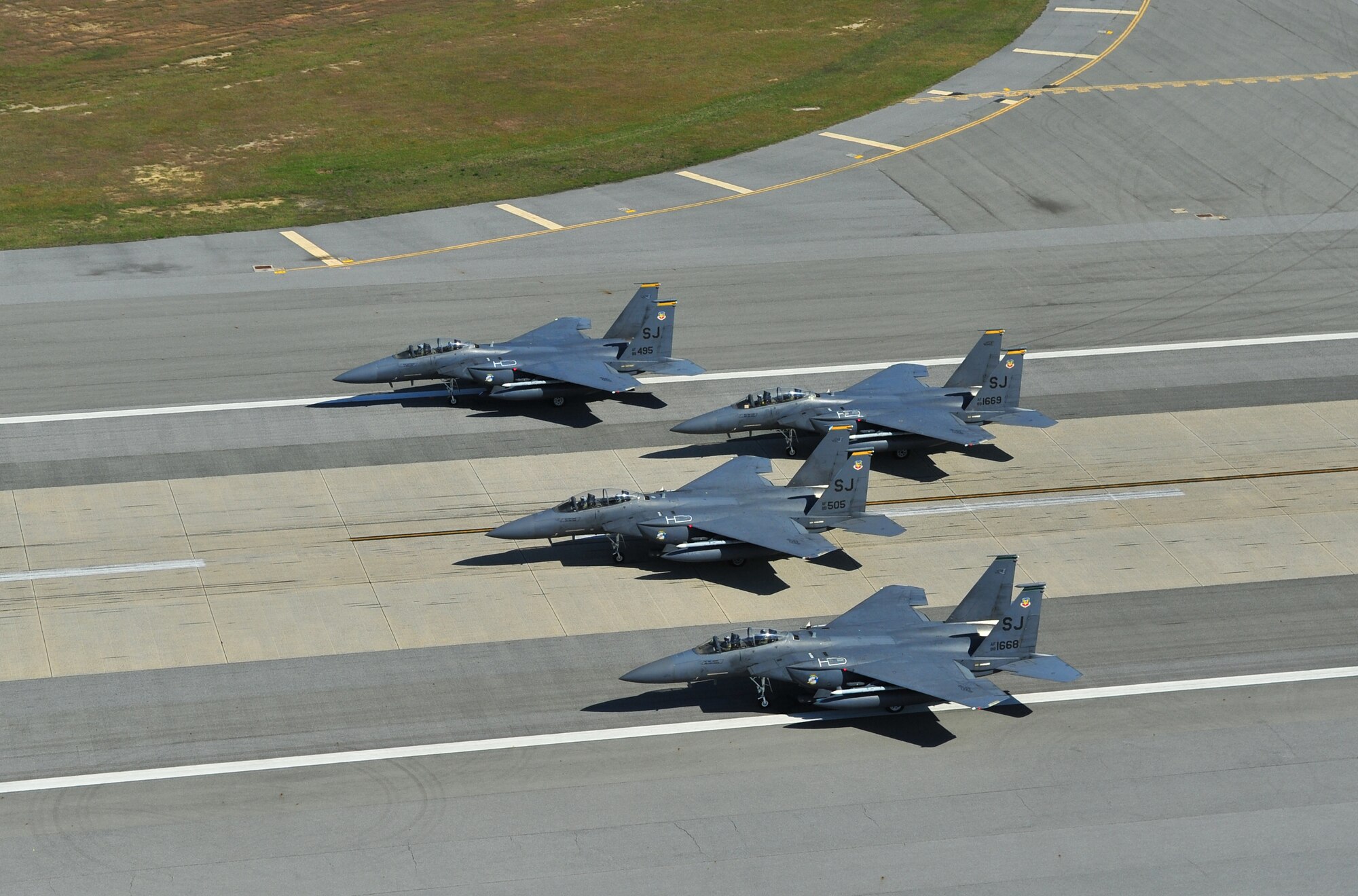 F-15E Strike Eagles of the 4th Fighter Wing perform an "Elephant Walk" as they taxi down the runway during a Turkey Shoot training mission on Seymour Johnson Air Force Base, N.C., April 16, 2012. The wing generated nearly 70 aircraft to destroy more than 1,000 targets on bombing ranges across the state to commemorate the 4th's victory over the Luftwaffe on April 16, 1945. The aircrews are assigned to the 4th Fighter Wing's 333rd, 334th, 335th, and 336th Fighter Squadrons. (U.S. Air Force Photo/Staff Sgt. Elizabeth Rissmiller)(Released)