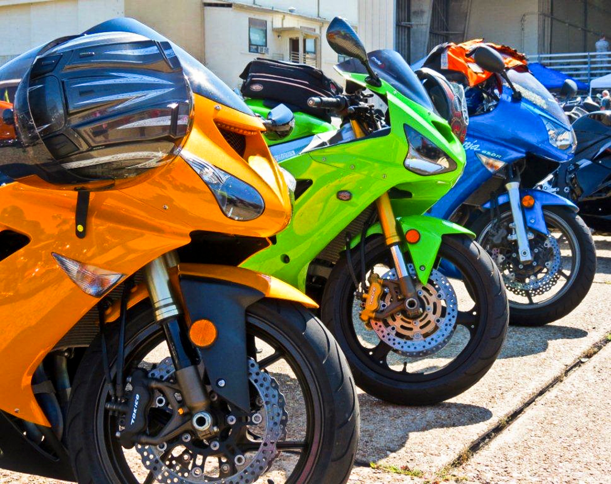 Brightly colored bikes sit on the flightline in front of the climatic lab April 13 at Eglin’s annual motorcycle safety rally.  The rally brought together a record number of 650 bikers from all services and bases for safety discussions, riding courses and group rides.  (U.S. Air Force photo/Irene Freiberg)