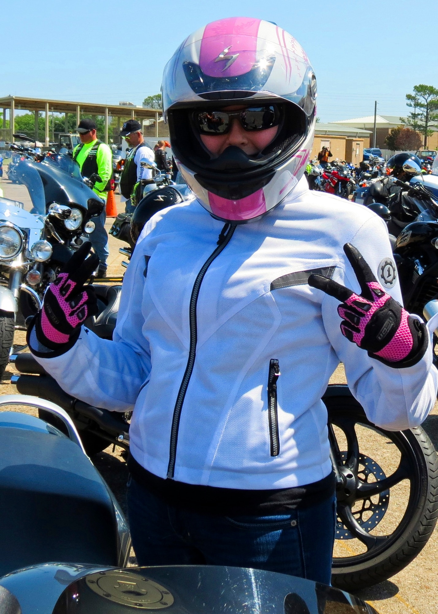 A rider shows she’s ready to ride at Eglin’s annual motorcycle safety rally.  The rally brought together a record number of 650 bikers from all services and bases for safety discussions, riding courses and group rides.  (U.S. Air Force photo/Irene Freiberg)