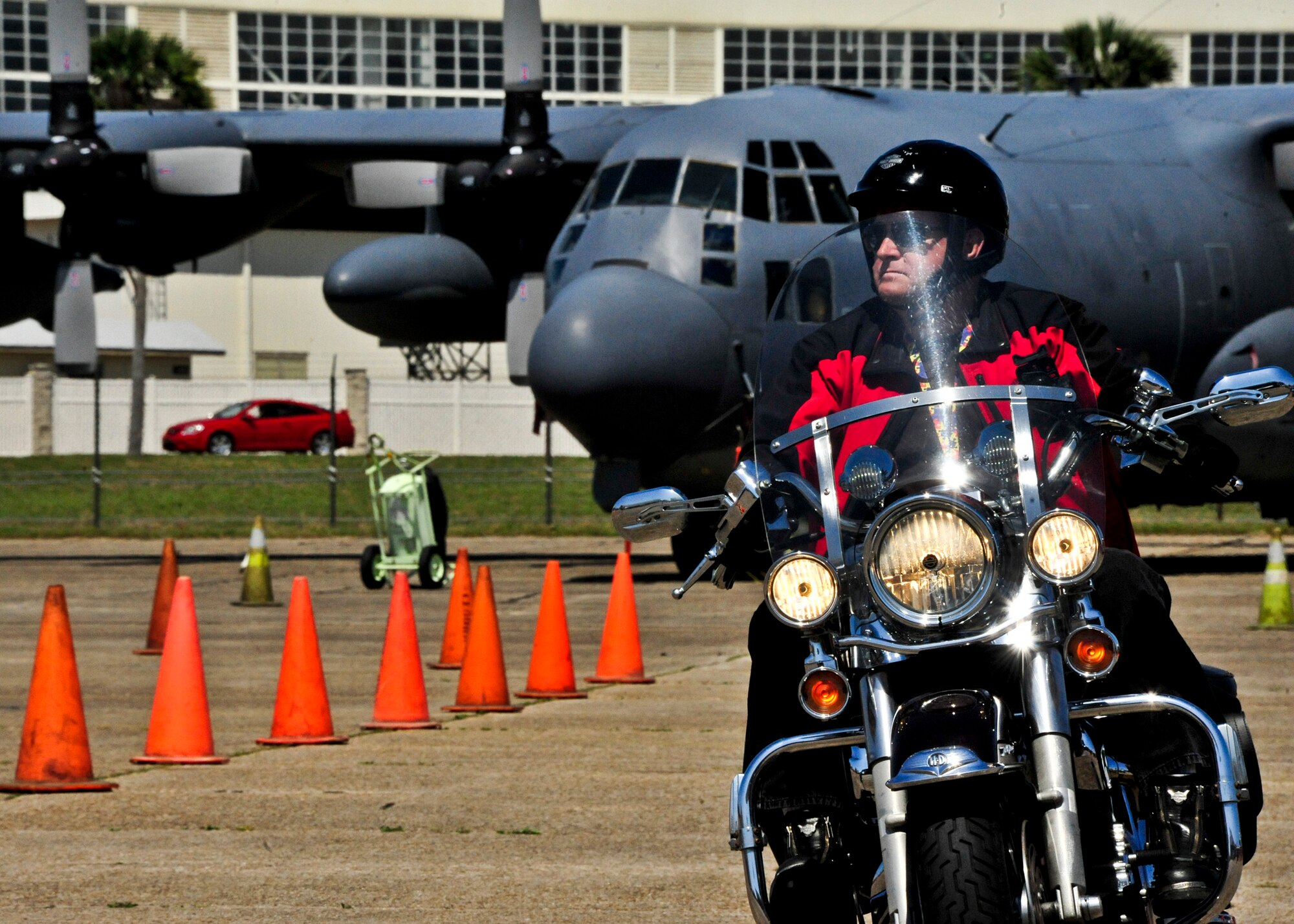 Jon Hemphill, of the 46th Test Squadron, takes a turn on the training course at Eglin’s annual motorcycle safety rally April 13.  The rally brought together a record number of 650 bikers from all services and bases for safety discussions, riding courses and group rides.  (U.S. Air Force photo/Randy Gon)