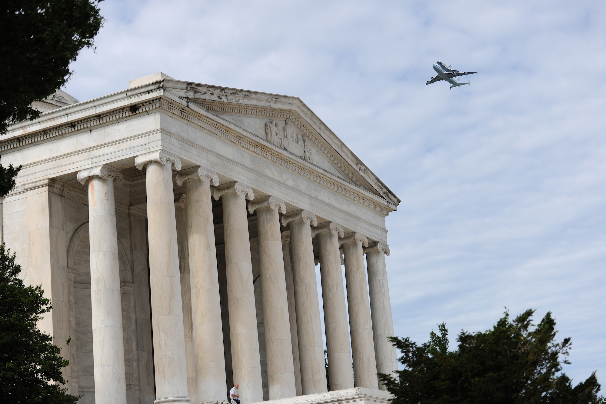 A NASA Shuttle Carrier aircraft carrying the space shuttle Discovery flies above the National Mall with a NASA chase plane escort April 17. The retired shuttle landed at the Washington Dulles International Airport for delivery to the National Air & Space Museum’s Udvar-Hazy Center. (U.S. Air Force photo/Senior Airman Amber Russell)