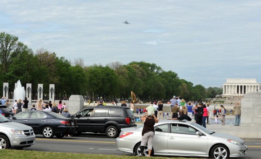 The space shuttle Discovery makes its final voyage April 17 as it rides piggyback on a modified Boeing 747 above the Lincoln Memorial in Washington, D.C.  The shuttle circled the National Mall several times before landing at Dulles International Airport, where it made the rest of the journey to the Smithsonian National Air and Space Museum annex in Virginia by truck.  (U.S. Air Force photo/Senior Airman Torey Griffith)

