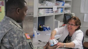 U.S. Army Sgt. 1st Class Taurus Buck, the McDonald Army Health Center Pharmacy Services NCOIC, turns in expired medication at the health center's pharmacy at Fort Eustis, Va., April 15, 2012. Individuals who wish to dispose of unwanted and unused prescription drugs may do so during the 2012 National Prescription Drug Take-Back Day event hosted April 28 at the Fort Eustis Exchange from 10 a.m. to 2 p.m. (U.S. Army photo by Marlon J. Martin/Released)