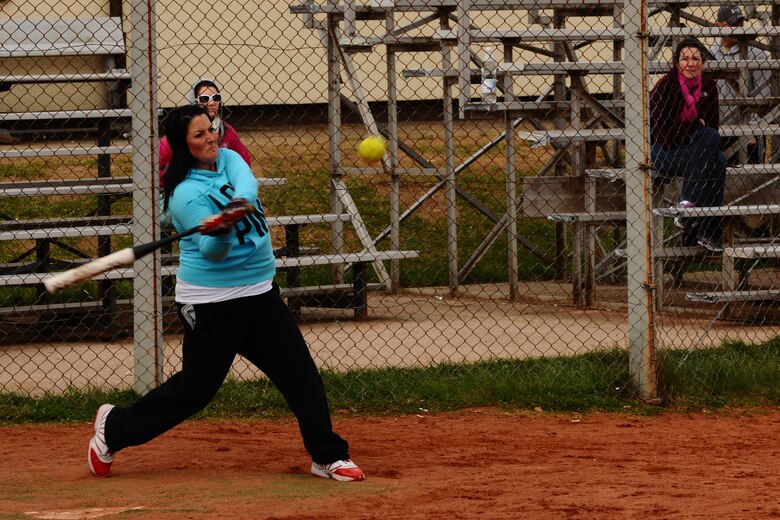 SPANGDAHLEM AIR BASE, Germany – Andrea Tuggle, wife of Garrett Tuggle, 52nd Civil Engineer Squadron, swings at a softball during a tournament on Field 1 here April 15. The first 52nd Maintenance Operations Squadron sponsored softball tournament included more than 12 teams made up of military and family members 18 and older and is intended to prepare players for the upcoming intramural season. The 52nd Civil Engineer Squadron team beat the 470th Air Base Squadron 19-17 in the final game of the double-elimination tournament. (U.S. Air Force photo by Airman 1st Class Dillon Davis/Released)