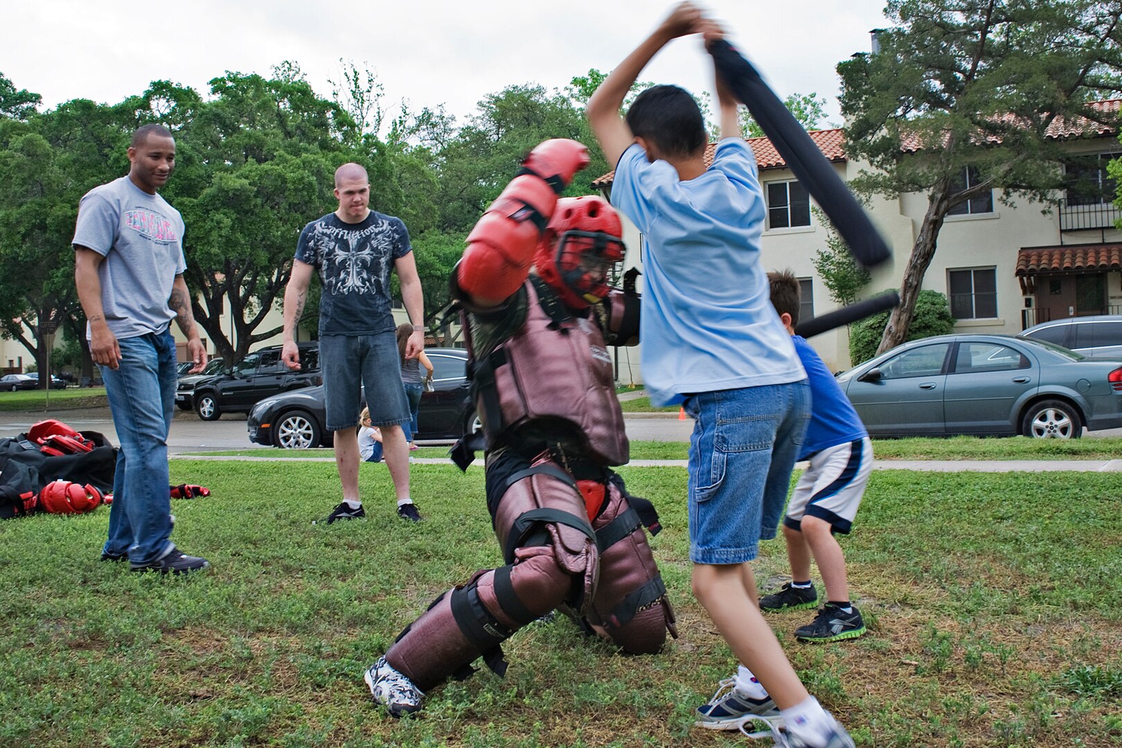 Waylon Hollingsworth and Jordan Regan use battons to subdue a potential attacker April 14 at Joint Base San Antonio Randolph, Texas. The 902nd Security Forces took part in the annual Famaganza celebration. (U.S. Air Force Photo by Benjamin Faske)