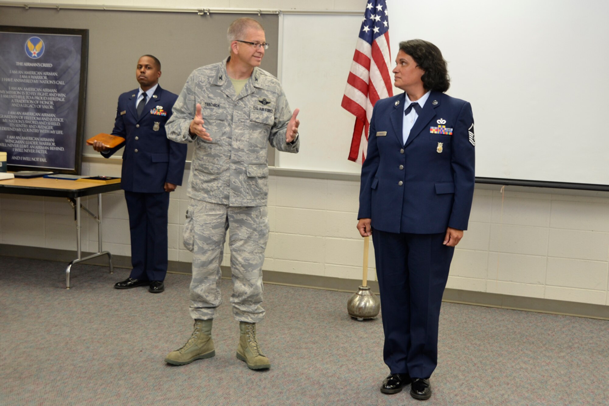Col. Tim Tarchick, 94th Airlift Wing commander, speaks at a retirement ceremony honoring Master Sgt. Hilda Elaine Moses, 94th Civil Engineer Squadron health and safety officer, who celebrated 23 years of dedicated service to the U.S. Air Force, April 14. “Looking back at Moses’ career, she can be summed up in one word… tough,” said Tarchick. (U.S. Air Force photo/Master Sgt. James Branch)