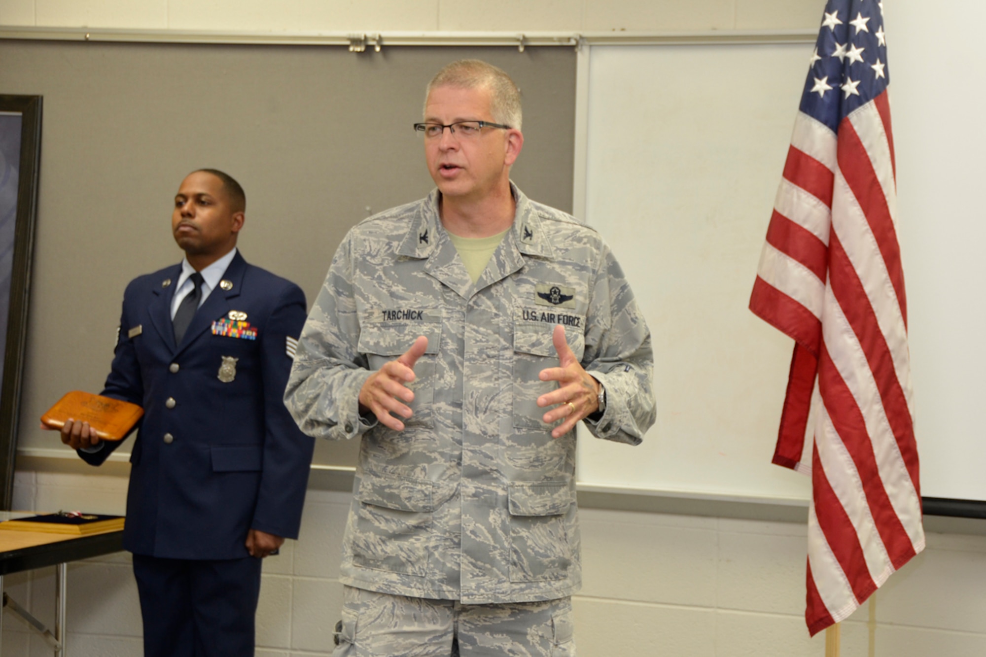 Col. Tim Tarchick, 94th Airlift Wing commander, speaks at a retirement ceremony honoring Master Sgt. Hilda Elaine Moses, 94th Civil Engineer Squadron health and safety officer, who celebrated 23 years of dedicated service to the U.S. Air Force, April 14. “Looking back at Moses’ career, she can be summed up in one word… tough,” said Tarchick. (U.S. Air Force photo/Master Sgt. James Branch)
