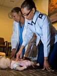 Lt. Col. Patricia John (right), 359th Medical Group chief nurse, and Staff Sgt. Andria King, Dental Logistics NCO in charge, perform mandatory CPR training at the base clinic April 2. (U.S. Air Force Photo by Benjamin Faske) 