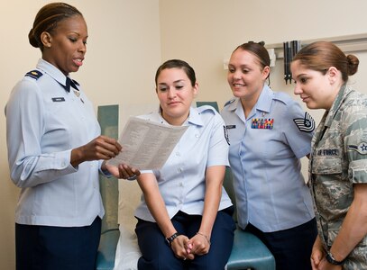 Maj. Stacy Greene, 359th Medical Group medical doctor, gives instruction to her medical technicians, Tech. Sgt. Julie Stewart, Staff Sgt. April Deluna and Airman Allison Chicwak April 2. Randolph celebrated Nurse Medical Technician Appreciation Week May 7-11. (U.S. Air Force Photo by Benjamin Faske) 