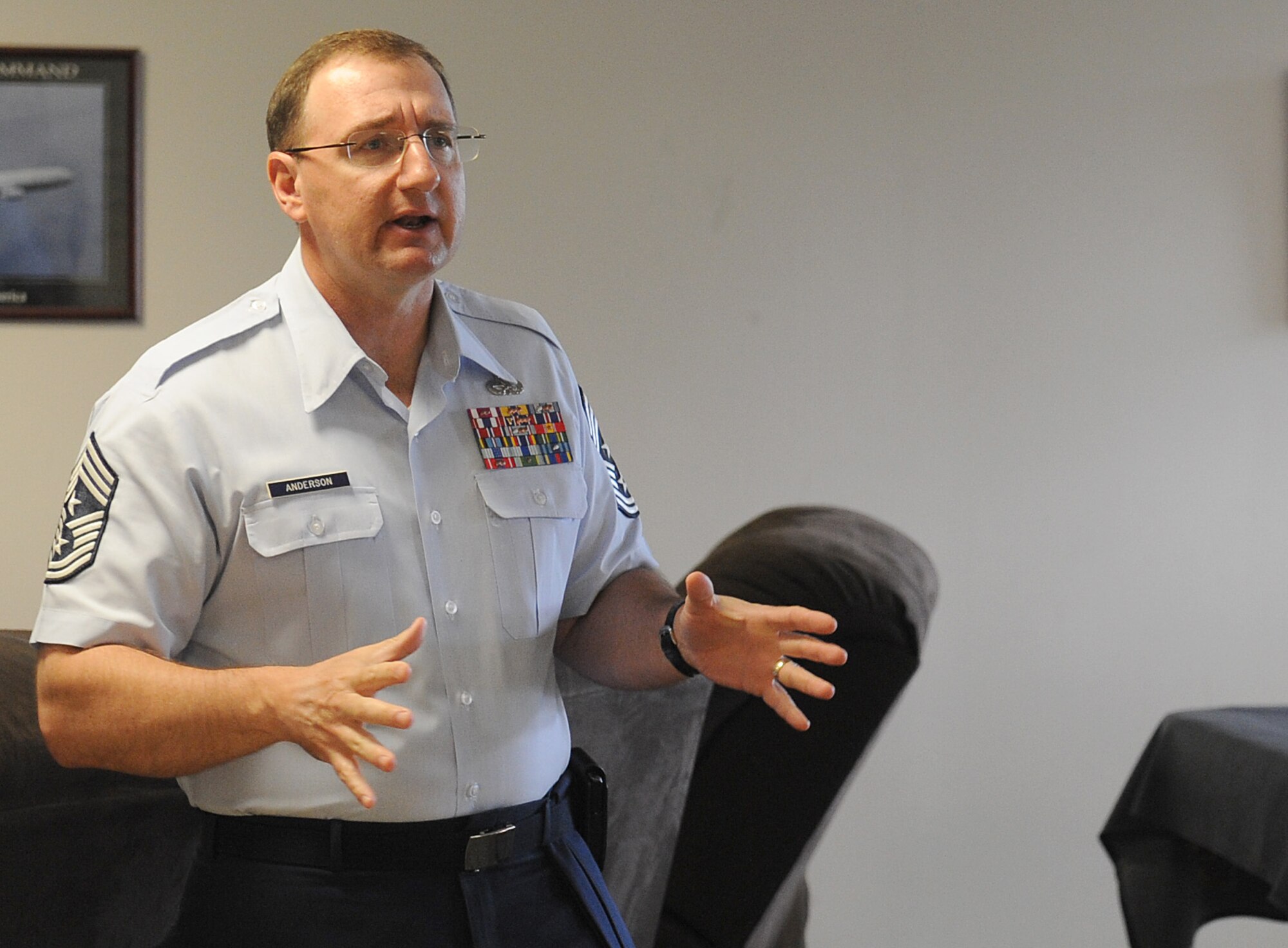 Chief Marty Anderson, 375th Air Mobility Wing command chief, speaks to Airmen from the fire department April 16 at Scott Air Force Base, Ill.  The Airmen had questions about base housing to ask Chief Anderson. (U.S. Air Force photo/Airman 1st Class Divine Cox)