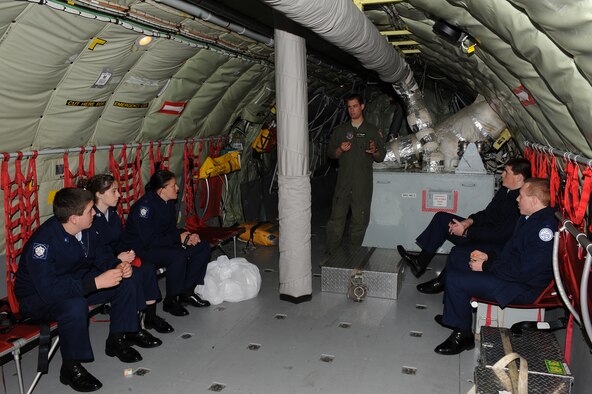 U.S. Air Force Senior Airman Andrew Steuart (center) speaks with Air Force Junior Reserve Officer Training Corps cadets prior to take-off on Seymour Johnson Air Force Base, N.C., April 12, 2012. As part of a program the 916th Air Refueling Wing offers, cadets are given an opportunity to see first-hand how pilots and boom operators complete their mission. Steuart, 77th Air Refueling Squadron boom operator, is a native of Raleigh, N.C. (U.S. Air Force photo/Airman 1st Class John Nieves Camacho/Released)