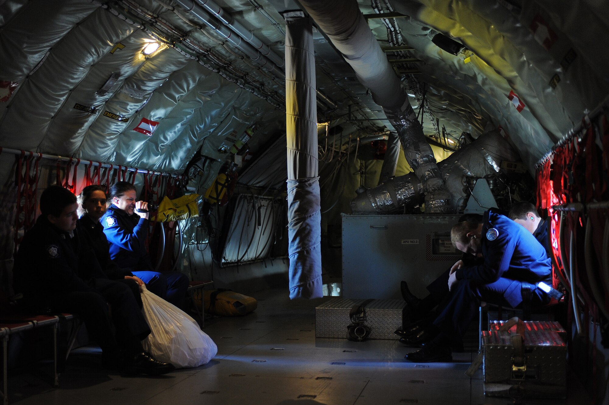 Air Force Junior Reserve Officer Training Corps cadets react to the starting of engines of a KC-135R Stratotanker on Seymour Johnson Air Force Base, N.C., April 12, 2012. For recruiting purposes selected cadets from all over N.C. receive an hour and a half incentive flight courtesy of the 916th Air Refueling Wing. (U.S. Air Force photo/Airman 1st Class John Nieves Camacho/Released)