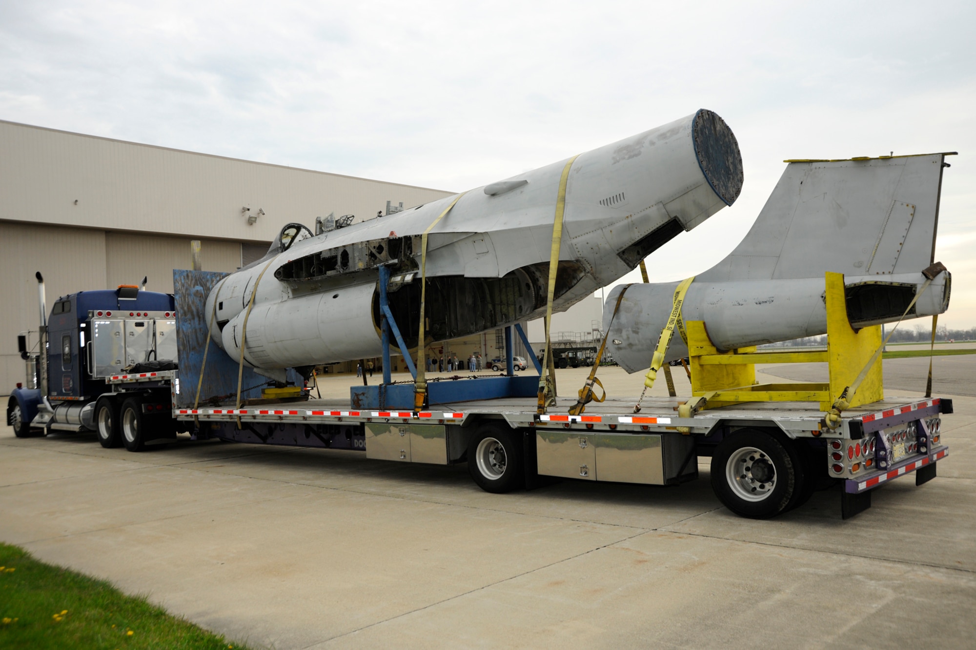 The fuselage and tail section of an F-89 Scorpion sit on a flatbed truck after being delivered to Selfridge Air National Guard Base, Mich., April 16, 2012. Once finished, volunteers at the Selfridge Military Air Museum believe they will have the only restored F-89 “C” model on display in the country, possibly the world. (U.S. Air Force photo by SSgt. Rachel Barton)