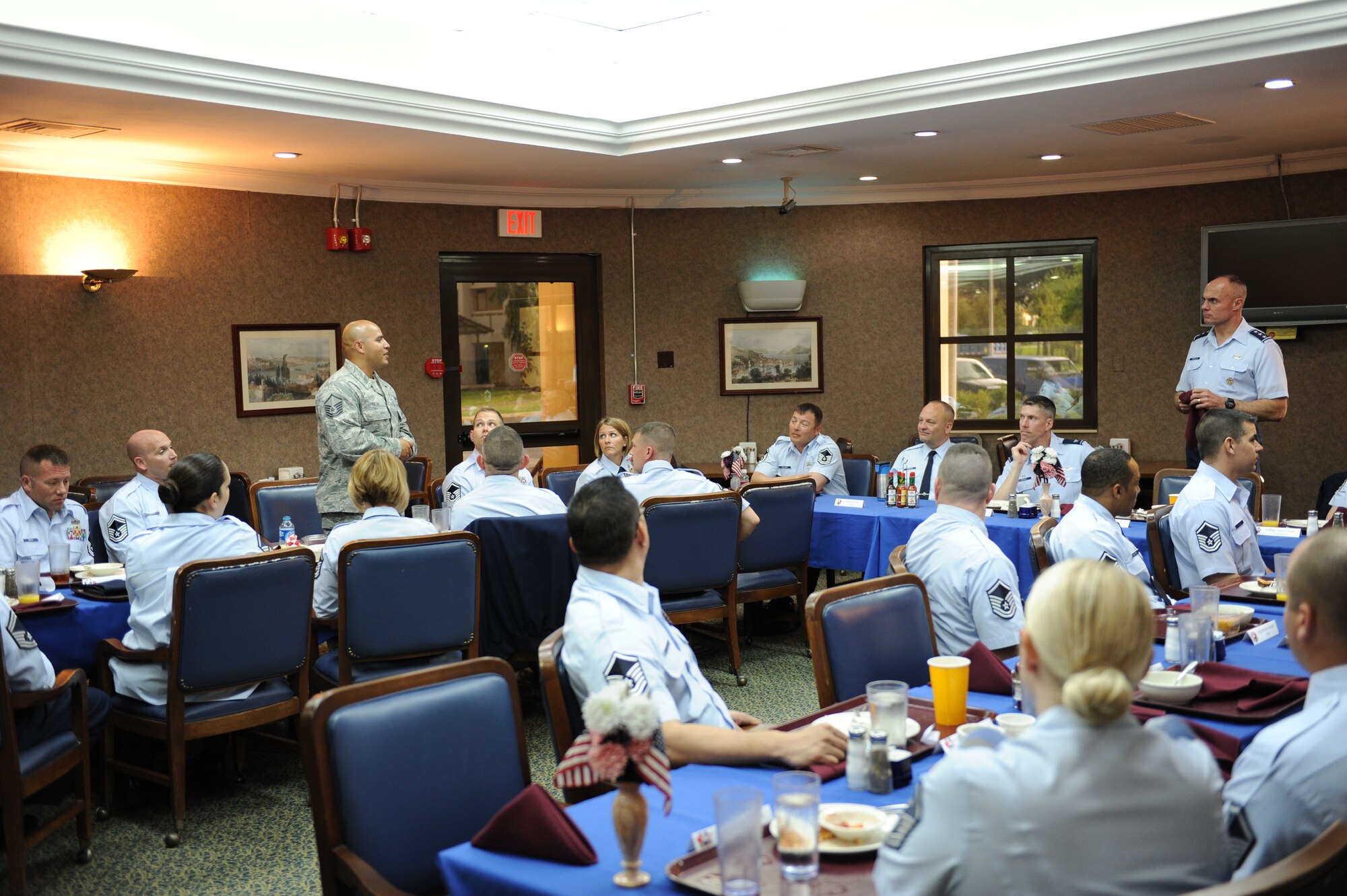 Master Sgt. Roberto Ruelas, 39th Security Forces Squadron NCO in charge of operations, standing left, discusses the mission of security forces Airmen to Lt. Gen. Craig Franklin, 3rd Air Force commander, standing right, during a breakfast at the Sultan's Inn Dining Facility April 16, 2012, at Incirlik Air Base, Turkey. This was Franklin's first visit to Incirlik since taking command of 3rd AF. During the visit, he expressed his gratitude to all Incirlik Airmen for their outstanding support of global missions and operations. (U.S. Air Force photo by Senior Airman Jarvie Z. Wallace/Released) 
