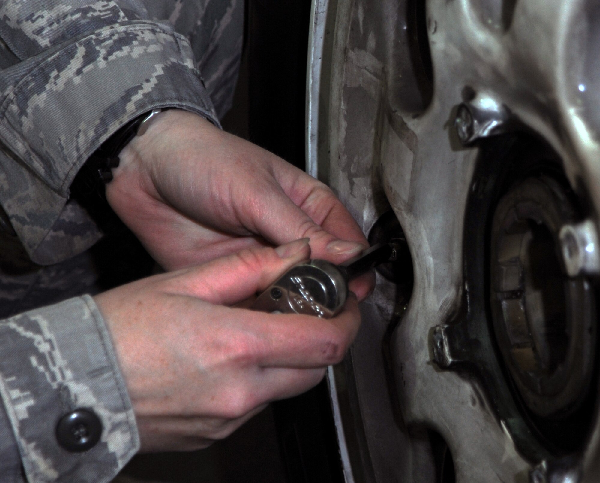 SOUTHWEST ASIA - Tech. Sgt. Tessa Holtz disassembles an F-15 Eagle wheel April 10, 2012. The Needsport, Ore., native is part of a new wheel and tire shop at the 380th Air Expeditionary Wing. She leads a team of six Airmen who provide maintenance to wheel and tire assemblies for fighter aircraft deployed to the 380th AEW. Holtz is deployed from Mountain Home Air Force Base, Idaho. (U.S. Air Force photo/Staff Sgt. J.G. Buzanowski)