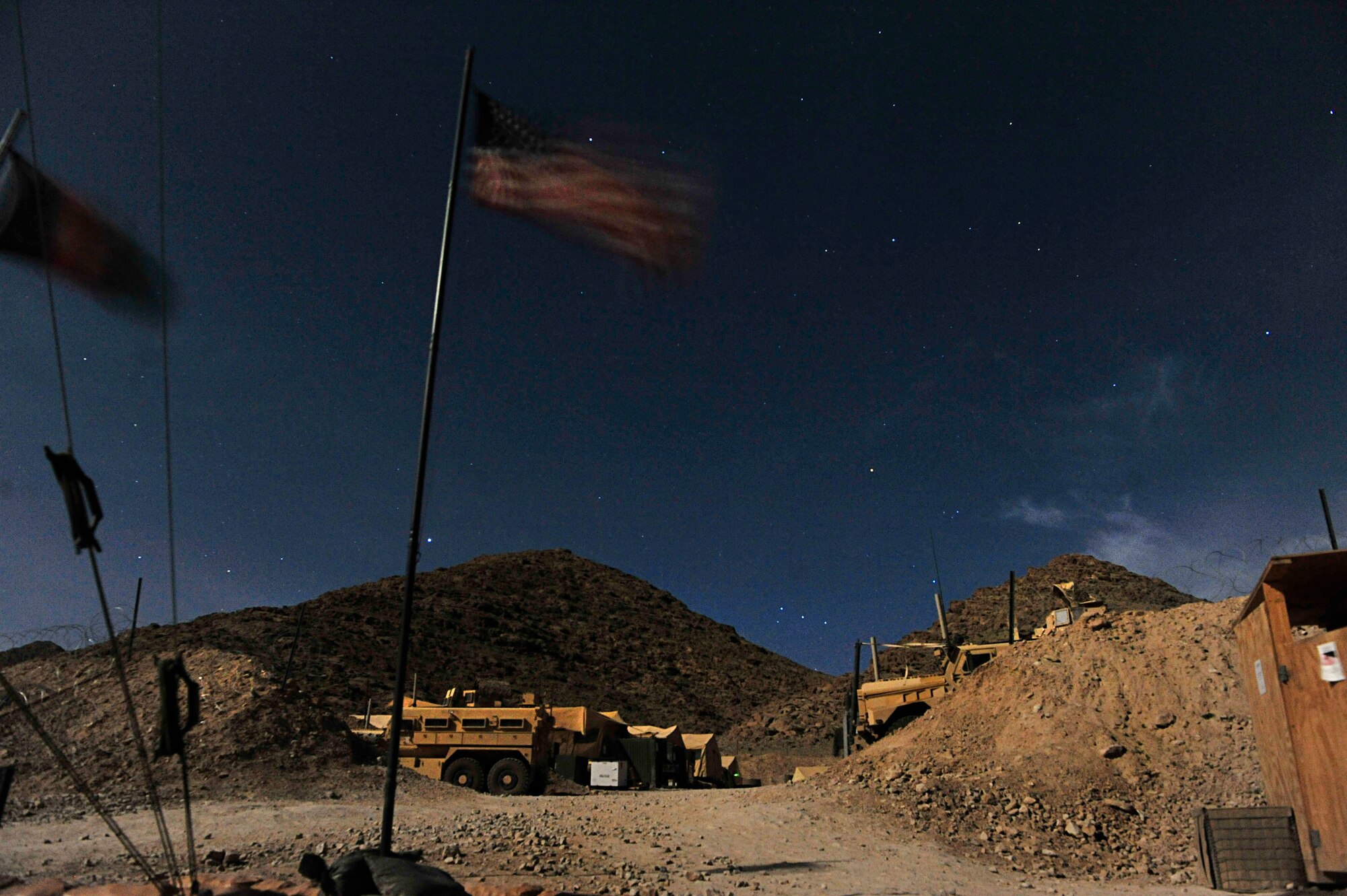 Forward Operating Base Whitehouse in Kajaki, Afghanistan, is lit up by moonlight alone, April 7, 2012. (U.S. Air Force photo by Staff Sgt. Sara Csurilla)