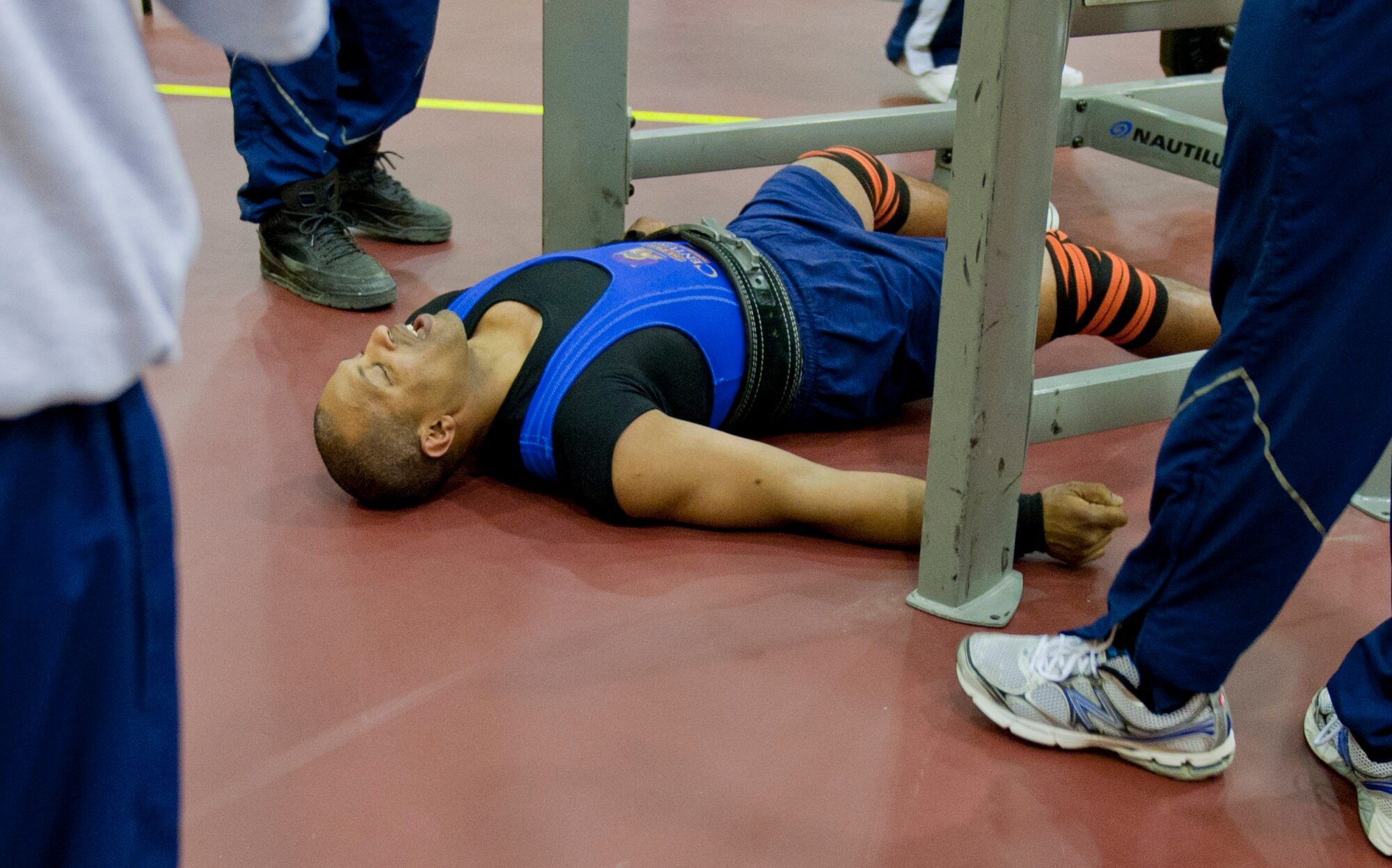 Jimmy Scott lays exhausted after squatting 635 pounds during a powerlifting competition April 14, 2012, at Incirlik Air Base, Turkey. Scott has more than 20 years of powerlifting experience. (U.S. Air Force photo by Senior Airman Anthony Sanchelli/Released)