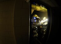 Firefighters from the 8th Civil Engineer Squadron report critical information back to their counterparts as part of a simulated structural fire exercise on Kunsan Air Base, Republic of Korea, April 17, 2012. The exercise was part of the fire department’s Consolidated Unit Inspection by the Pacific Air Forces Inspector General team. (U.S Air Force photo/Senior Airman Jessica Hines)