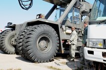 Pacific Air Forces Inspector General team member Master Sgt. Amunda Rivers, left, talks to Master Sgt. Jason Novak, 8th Logistics Readiness Squadron vehicle management quality assurance, about the base’s inventory, April 17, 2012, on Kunsan Air Base, Republic of Korea. Airmen at the 8th LRS have been working seven days a week to ensure their equipment is ready for inspection. (U.S. Air Force photo/Senior Airman Brigitte N. Brantley)