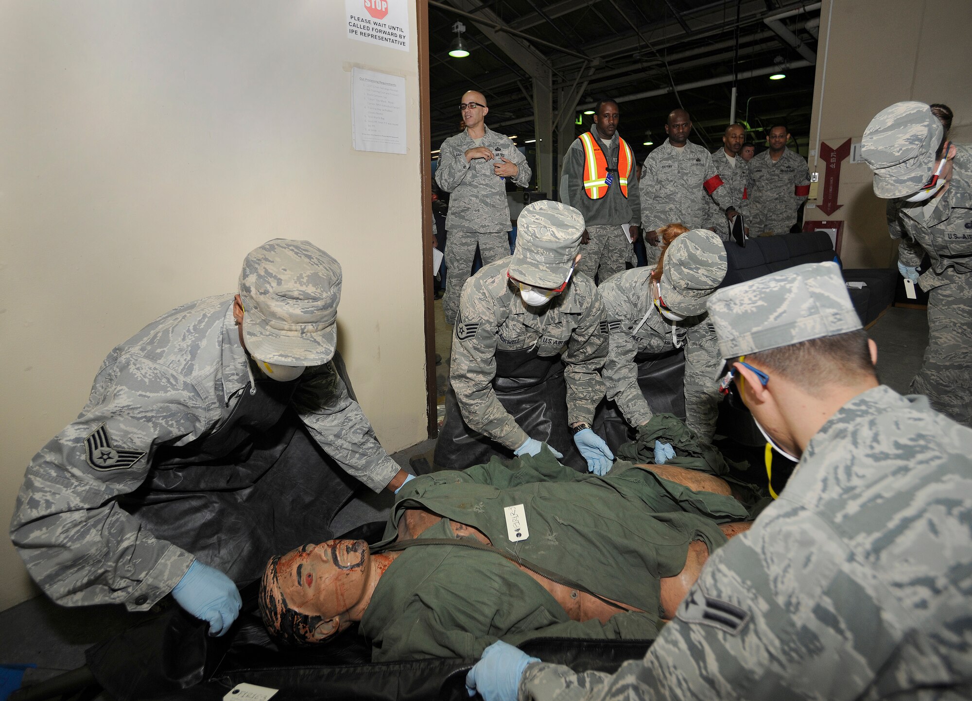 Members of the search and recovery team at Kunsan Air Base, Republic of Korea, attend to a dummy victim during a simulated explosion exercise on April 16, 2012. The team was evaluated by both 8th Fighter Wing exercise evaluation and Pacific Air Forces Inspector General team members as part of an ongoing inspection of the Wolf Pack. (U.S. Air Force photo/Staff Sgt. Rasheen Douglas)
