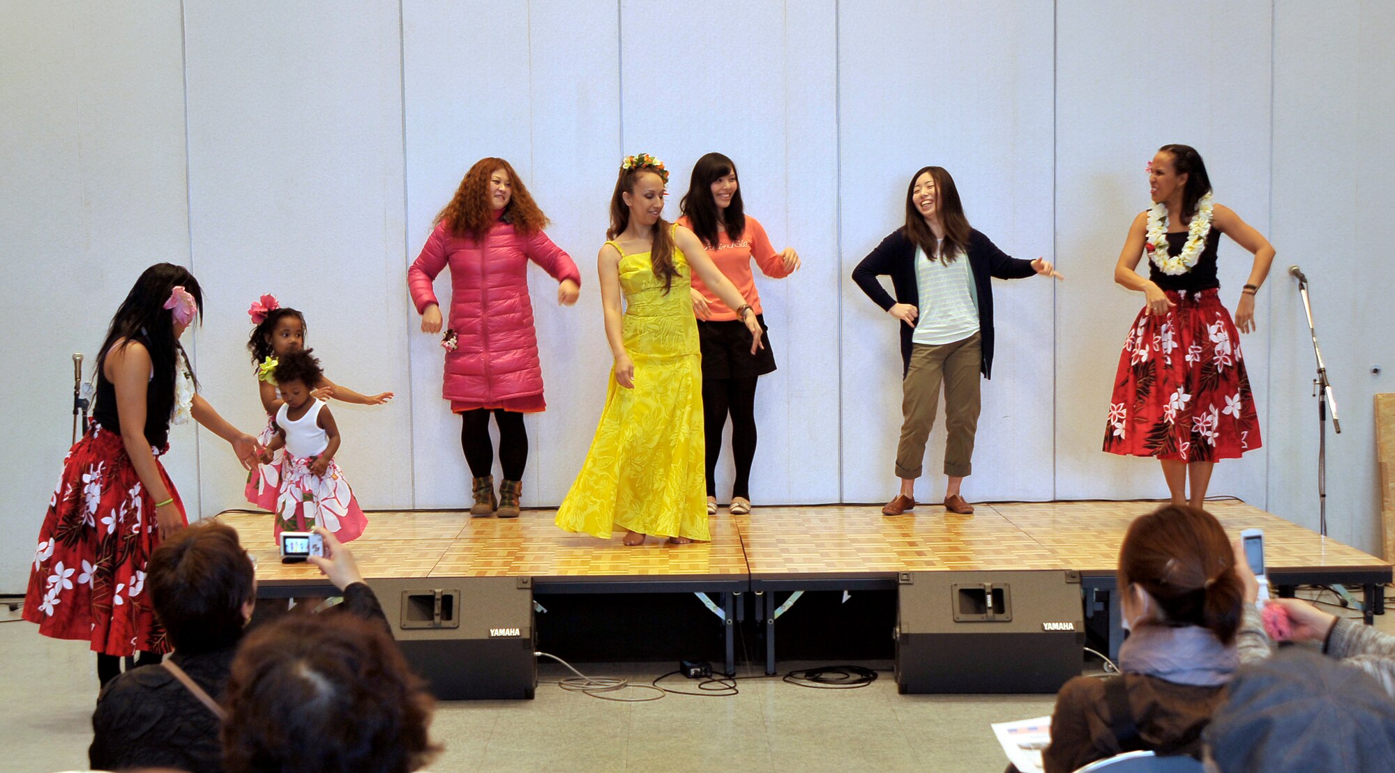 Misawa Air Base Hula Dancers teach people displaced from their homes in Iwate Prefecture, Japan, how to hula during Mini-American Day event at Hanamaki, Japan, April 14, 2012. Members of the Misawa Air Base community provided American style food, games, music and dance performances at the event. The Mini-American Day was put on for the people displaced from their homes in the Iwate Prefecture, Japan, by the earthquake and subsequent tsunami of March 11, 2011. (U.S. Air Force photo by Staff Sgt. Nathan Lipscomb/Released)