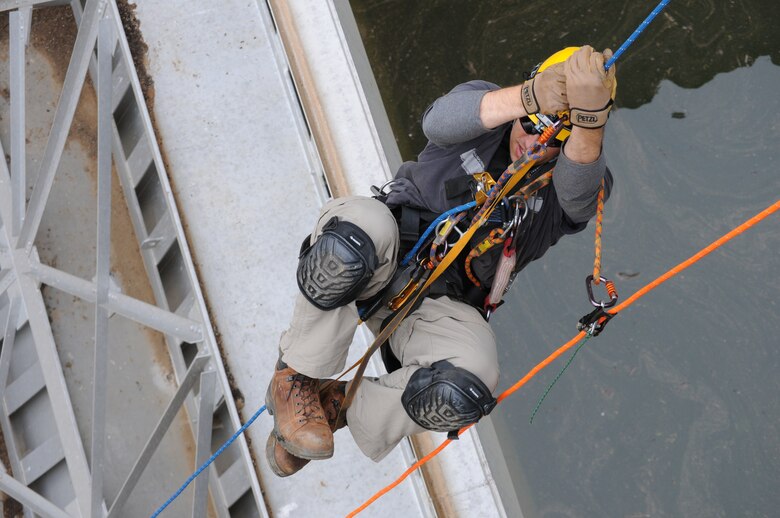 CALIFORNIA —  Christopher Abela, a civil engineer with the U.S. Army Corps of Engineers Sacramento District ascends a climbing rope during an inspection of the tainter gates at New Hogan Dam near Valley Springs, Calif., April 10, 2012. Tainter gates are a type of flood gate used in dams to control water flow. New Hogan Dam reduces flood risk to the city of Stockton and stores water used for irrigation, drinking and hydroelectric power. 