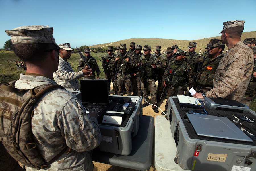 Chief Warrant Officer 2 James O'Brien, the evacuation control center officer-in-charge with Combat Logistics Battalion 24, 24th Marine Expeditionary Unit explains how they operate an ECC to Marines with the Spanish Marine Corps April 17, here, during bi-lateral tactics training between the 24th Marine Expeditionary Unit and the Spanish Marine Corps. The 24th MEU, partnered with the Navy's Iwo Jima Amphibious Ready Group, is deployed to the European and Central Command theaters of operation to serve as a theater reserve and crisis response force capable of a variety of missions from full-scale combat operations to humanitarian assistance and disaster relief.