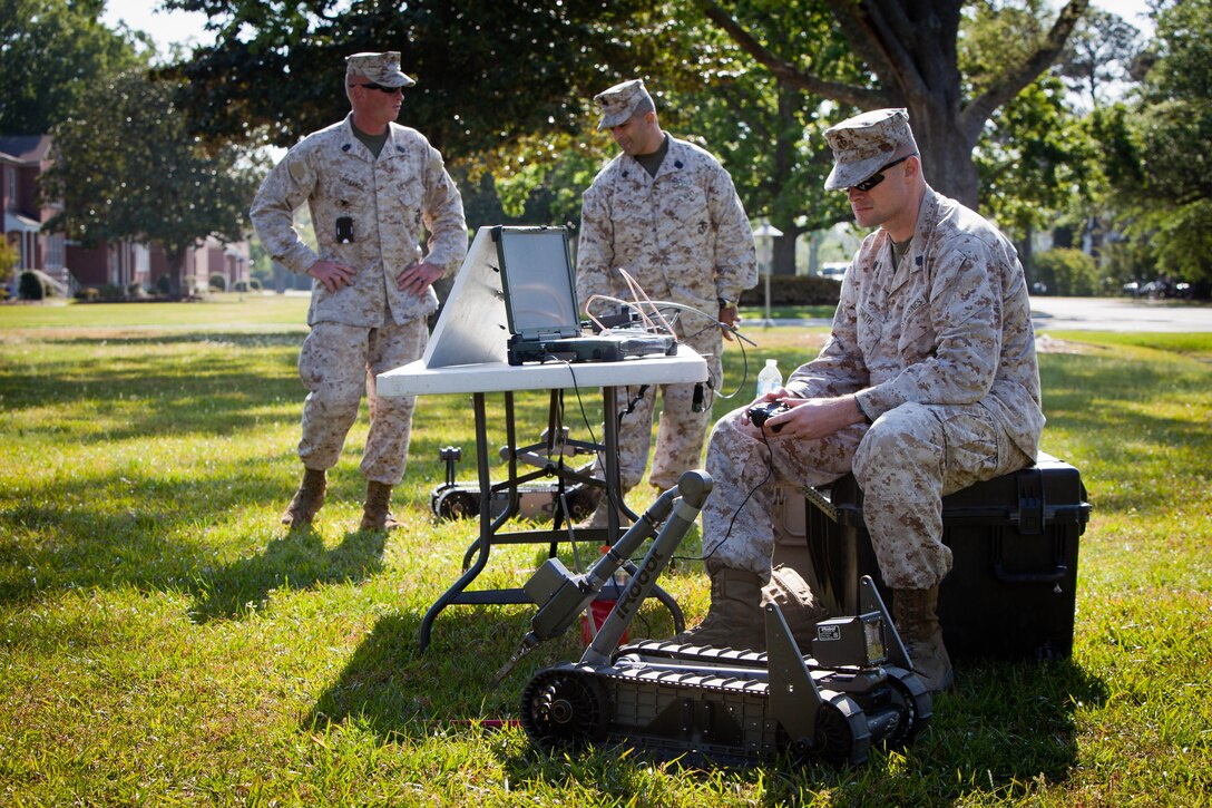 Staff Sgt. Jamie Smith an instructor from Yadkinville, N.C., with II Marine Expeditionary Force Headquarters Group, demonstrates how to use an explosive ordnance disposal robot during counter improvised explosive device awareness training, April 17, at Camp Lejeune, N.C. The training provided participants with a look at what tools and techniques are available to counter the threat of roadside bombs during deployment.