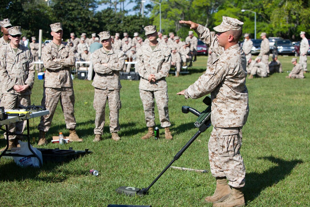 Cpl. Ernest Tubbs, an instructor from Parsonsburg, Md., with II Marine Expeditionary Force Headquarters Group, teaches a class on the proper use of a mine detector during counter improvised explosive device awareness training, April 17, at Camp Lejeune, N.C. The training provided participants with a look at what tools and techniques are available to counter the threat of roadside bombs during deployment.