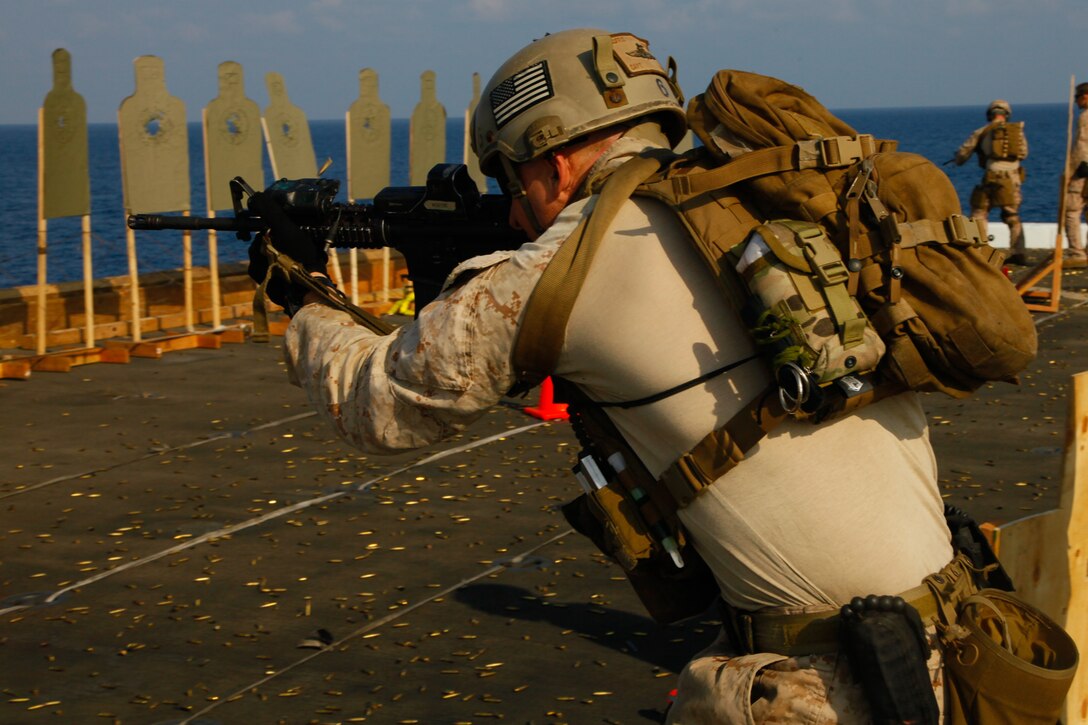 Capt. Eric Moffit engages targets with an M4 rifle during a live-fire exercise aboard USS New Orleans here April 17.  Moffit serves as a platoon commander with the 11th Marine Expeditionary Unit’s maritime raid force. The unit is deployed as part of the Makin Island Amphibious Ready Group, currently a U.S. Central Command theater reserve force. The group is providing support for maritime security operations and theater security cooperation efforts in the U.S. Navy's 5th Fleet area of responsibility.