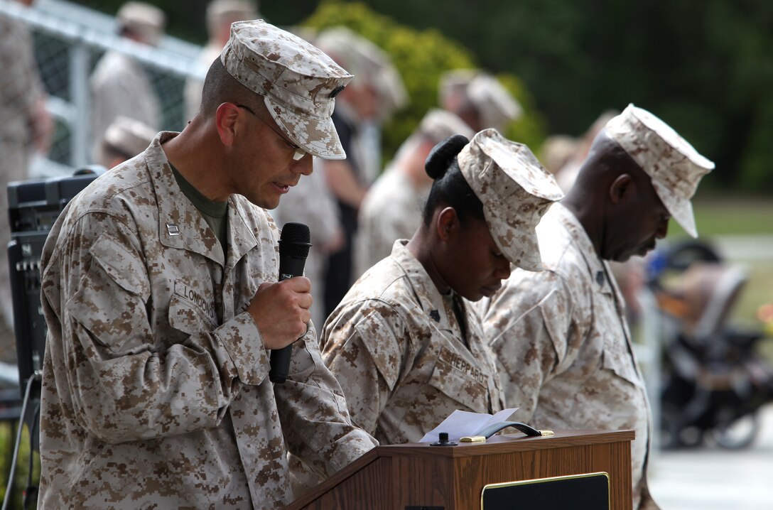 Navy Lt. Deigo Lundono, the chaplain for Combat Logistics Battalion 22, delivers the invocation during a change of command ceremony at Soifert Field aboard Camp Lejeune, April 18, 2012. Lt. Col. Matthew B. Reuter relinquished command of the battalion to Lt. Col. William P. Carroll after two years at the helm.  (Sgt. Justin J. Shemanski)